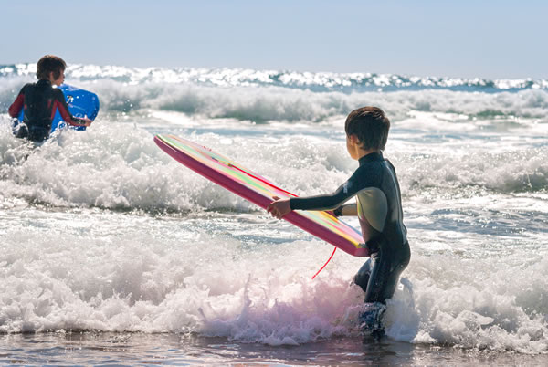 two boys surfing