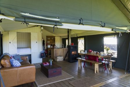 A view of the living area of the safari tent with the front up